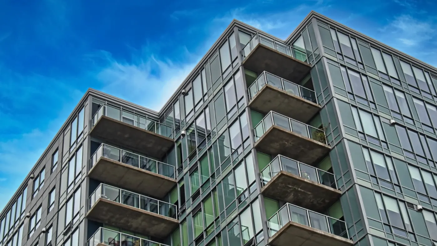 Glass-balconied apartments in a modern residential tower